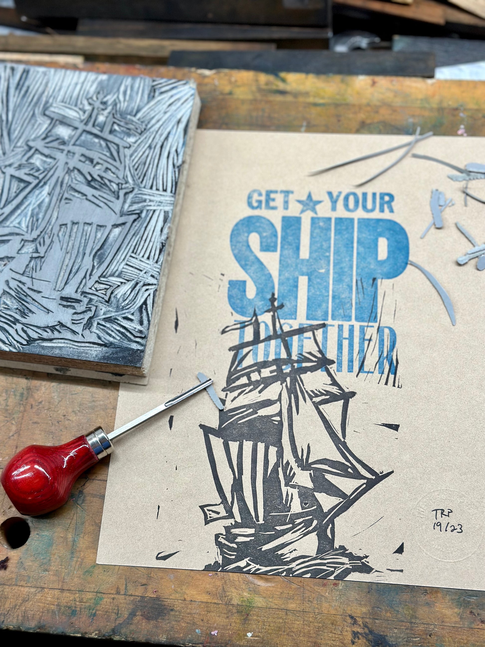 Get Your Ship Together - Handmade Letterpress Art print - pictured with the hand-carved block used to make the art.