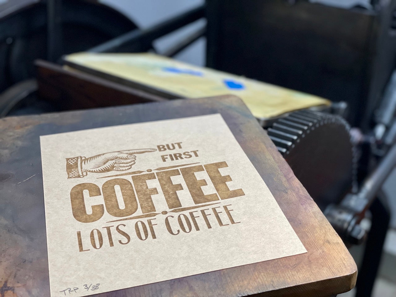 But First Coffee x10 Letterpress print on brow kraft paper with The Rugged Press in background