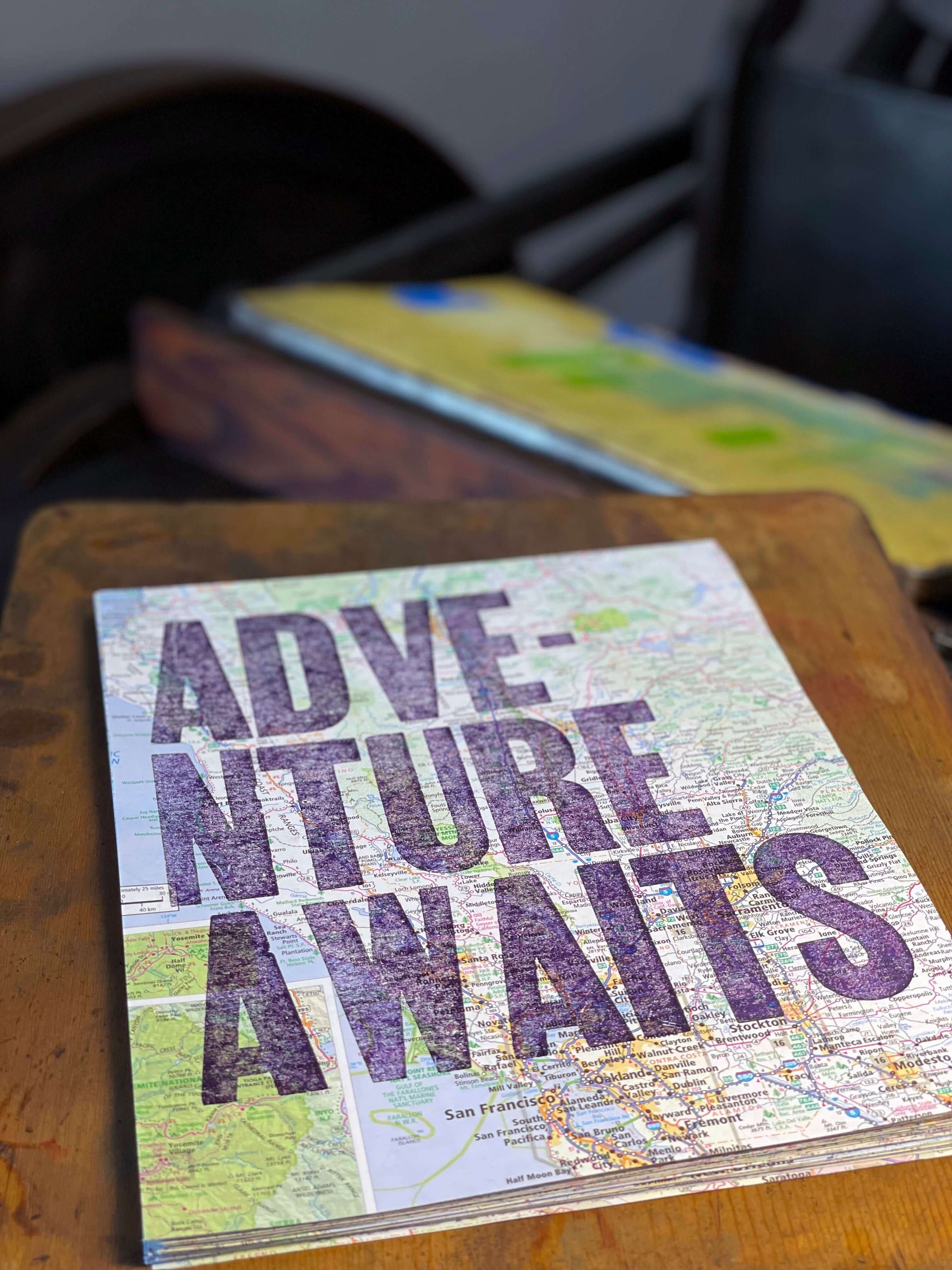 Adventure Awaits - 8x10 Letterpress print on road map with The Rugged Press in background