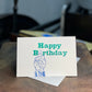 Happy Birthday with Middle finger 4x6in letterpress greeting card with The Rugged Press in background